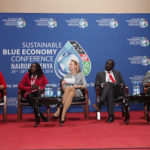 contains an image of five panelist during a blue economy conference